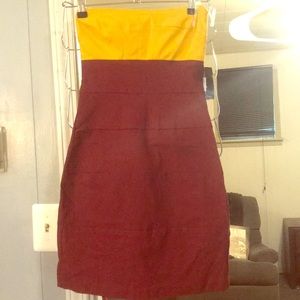 Fitted garnet and gold dress
